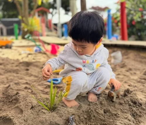 Sensory Play at Little Teddies Child exploring and learning through sensory play at Little Teddies Early Learning & Childcare Centre